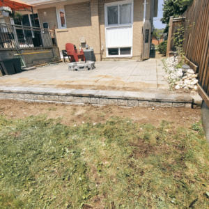 Revitalizing Stability: Our team transformed a crumbling landscape into a vision of strength and beauty. See how we replaced a failing retaining wall with a robust structure that promises enduring support and lasting charm.